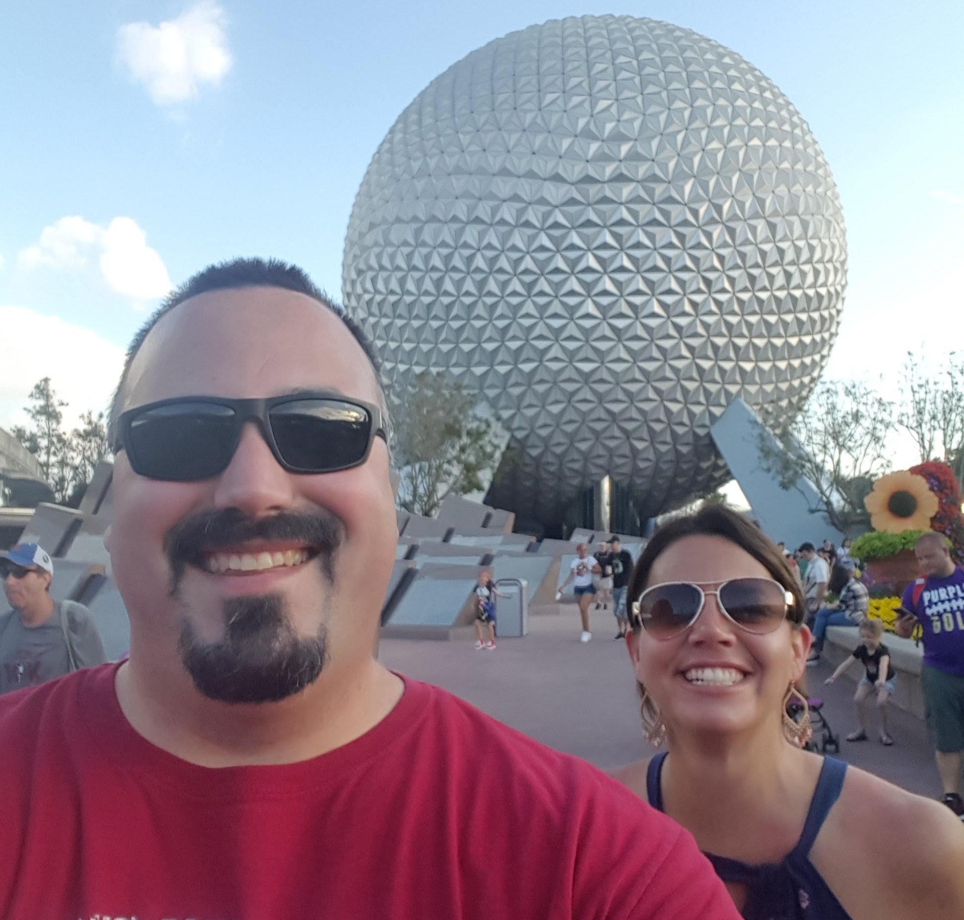 me and my sister in front of the Epcot ball